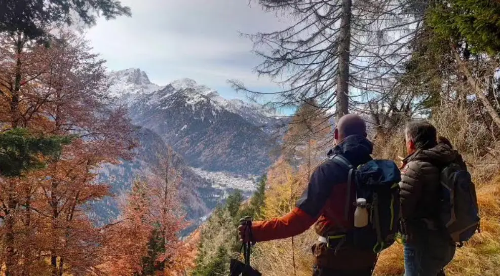 Hikers exploring the Dolomites with LAREFA in autumn